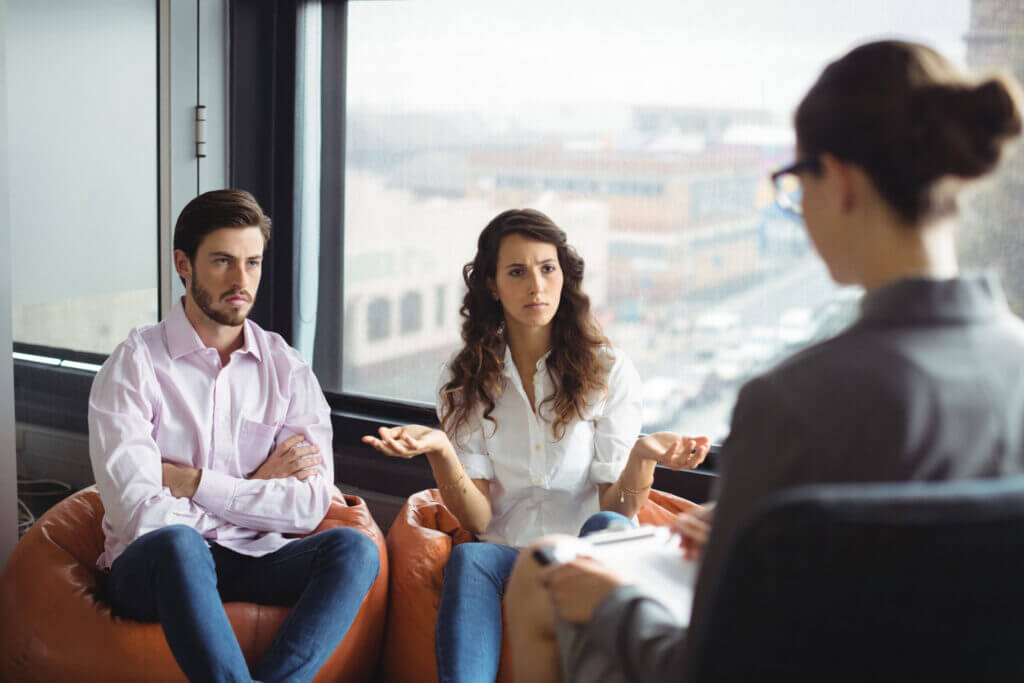 Couple talking to a marriage counselor during therapy